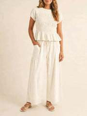 Smocked Peplum Top And Wide-leg Pants Set in Terracotta, close-up detail