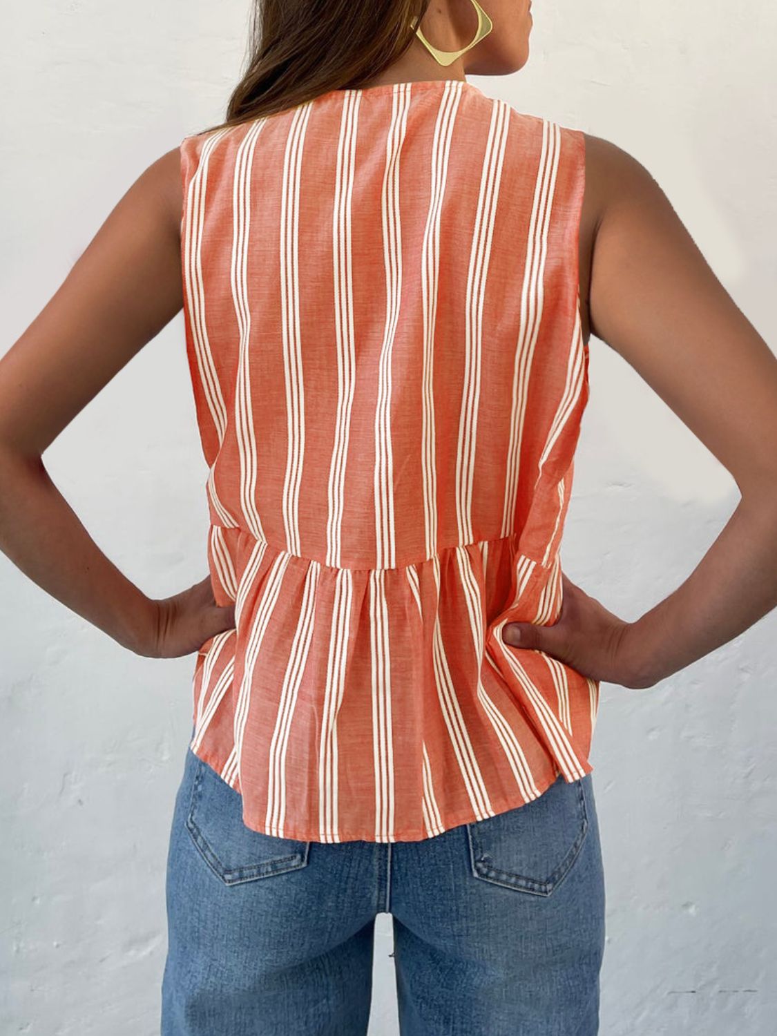 Orange stripe peplum blouse with bow-tie back detail