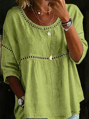 Light green bohemian t-shirt with openwork detail at neckline and waist, 3/4 sleeves