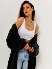 Black oversized ribbed knit maxi cardigan with balloon sleeves.