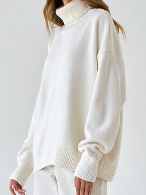 White relaxed roll-neck sweater with boxy fit and ribbed cuffs and hem