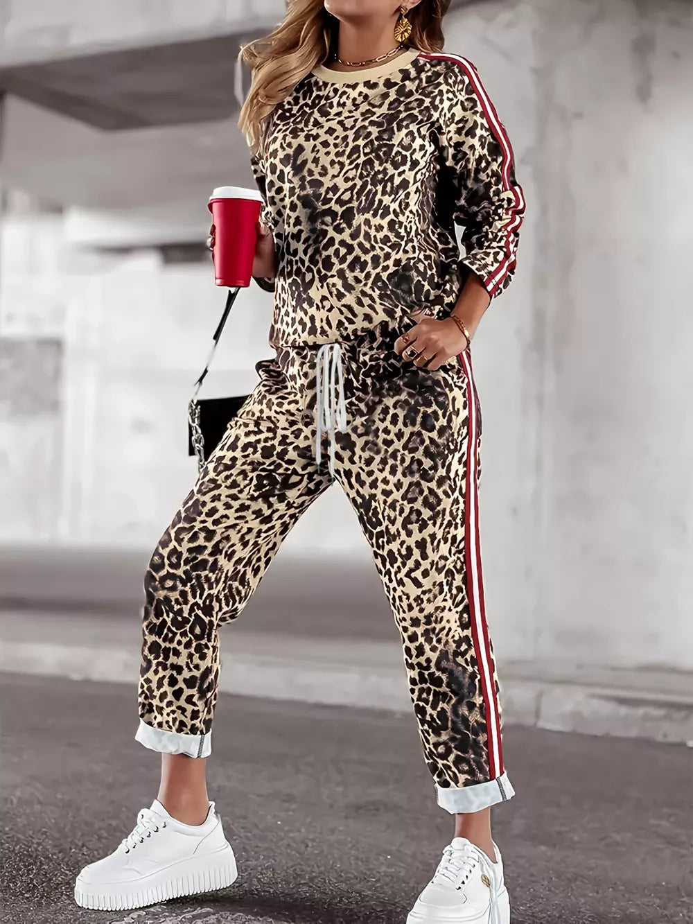 Leopard print loungewear set with red stripe detail on sleeves and pants.