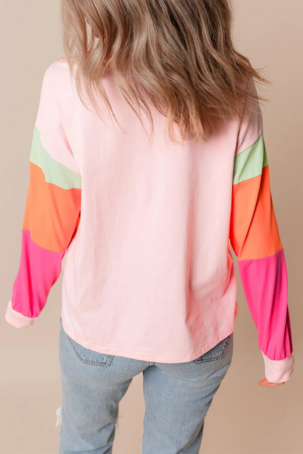 Colorblock long sleeve t-shirt in blush pink with color block sleeves in mint green, orange, and hot pink.