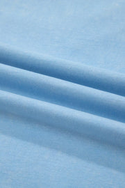 Light blue cotton relaxed V-neck top and skort ensemble fabric detail