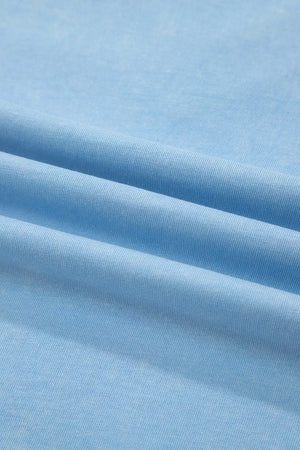 Light blue cotton relaxed V-neck top and skort ensemble fabric detail