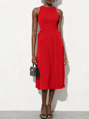 Red A-line midi dress with high neckline, sleeveless, defined waist, and pockets.