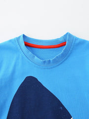 Blue cotton t-shirt with red trim and a dark blue graphic.