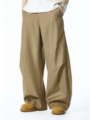 Men's deep khaki relaxed fit oversized sweatpants with panel details.