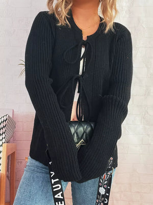 Black ribbed tie-front cardigan with cuffed sleeves and a casual cut.