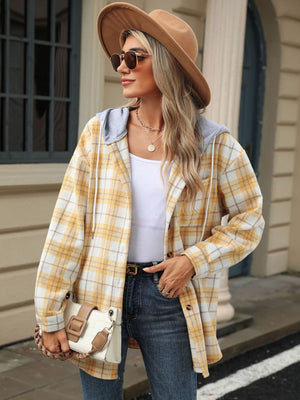 Pastel yellow plaid shacket with contrast hood and buttons, worn open over a white top.