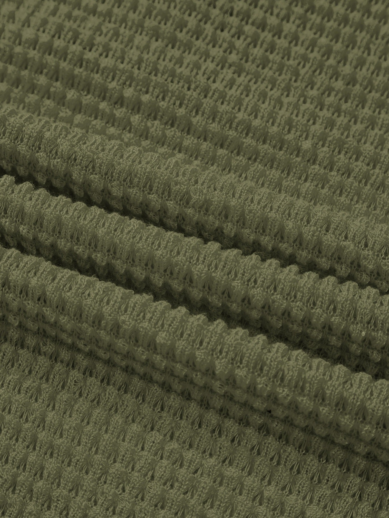 Moss waffle-knit polo shirt fabric detail