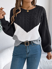 Chevron cable knit sweater in black, white, and grey with a crew neck.