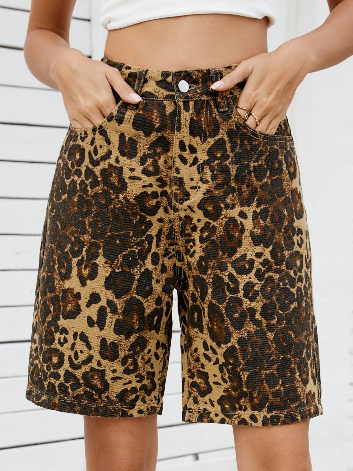 Leopard print denim bermuda shorts with a comfortable, casual fit.