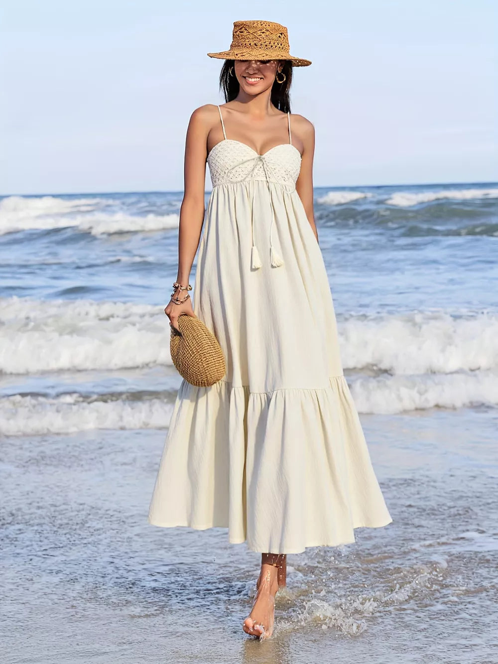 Cream ruched sweetheart neck maxi dress with tiered skirt and tassel detail
