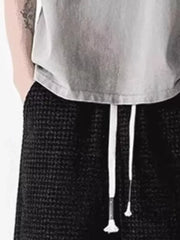 Men's black waffle-knit casual shorts with white drawstring