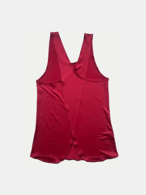 Deep Red flowy tank top with a cross-back detail and a satin-like sheen.