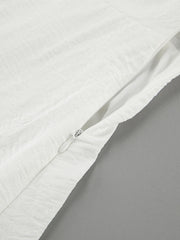 White off-shoulder midi dress with textured fabric and side zipper detail