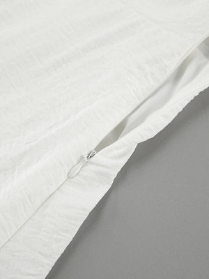 White off-shoulder midi dress with textured fabric and side zipper detail