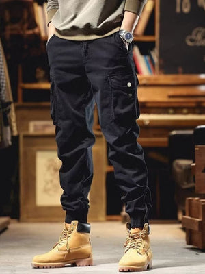 Men's black cargo joggers with drawstring and cuffed ankles.