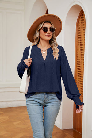 Navy eyelet detail blouse with V-neck and poet sleeves