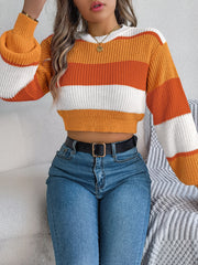 Striped acrylic crop knit sweater with balloon sleeves in tangerine, white, and orange.