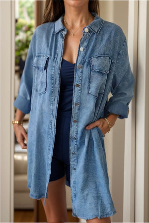 Light blue oversized denim shirt jacket with buttoned front and chest pockets.