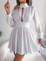 White fit-and-flare mini dress with keyhole neckline, long sleeves, and A-line skirt.