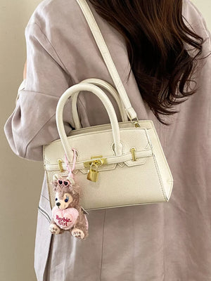 Lock Detail Top Handle Crossbody Bag in White, model styling view