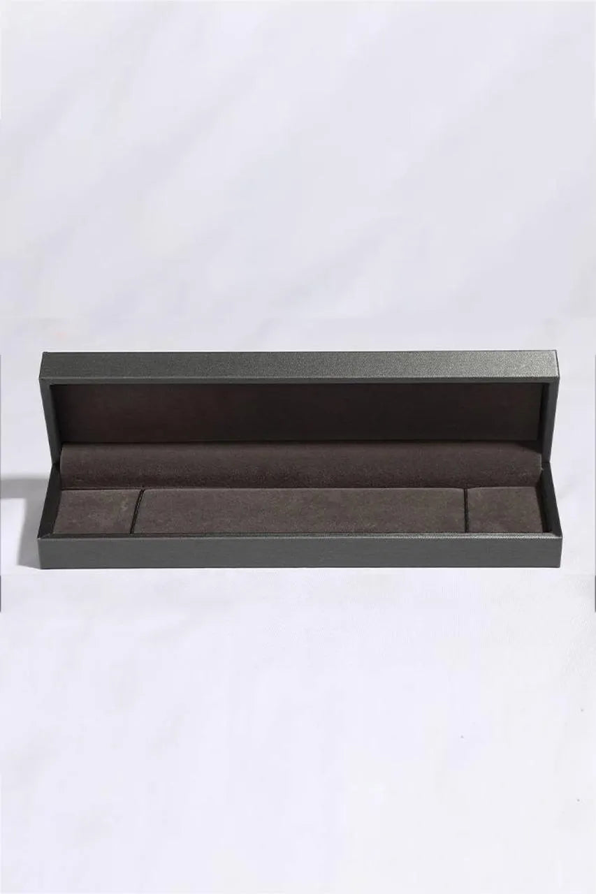 Sparkling Moissanite Silver Luxe Bracelet presentation box with dark grey exterior and brown velvet lining.