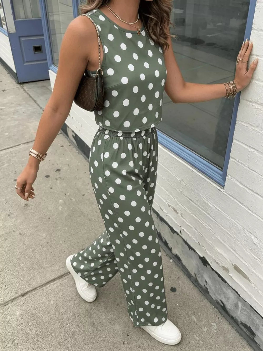 Green polka dot crop top and wide-leg pants set with a round neckline and sleeveless design.