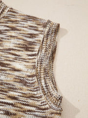 Horseshoe knit sweater vest in brown and white marled acrylic with a crew neck.