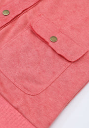 Washed cotton utility jacket in burnt coral with snap-button flap pockets and ribbed hem.