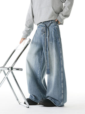 Belted relaxed fit men's light blue denim jeans with a wide leg.