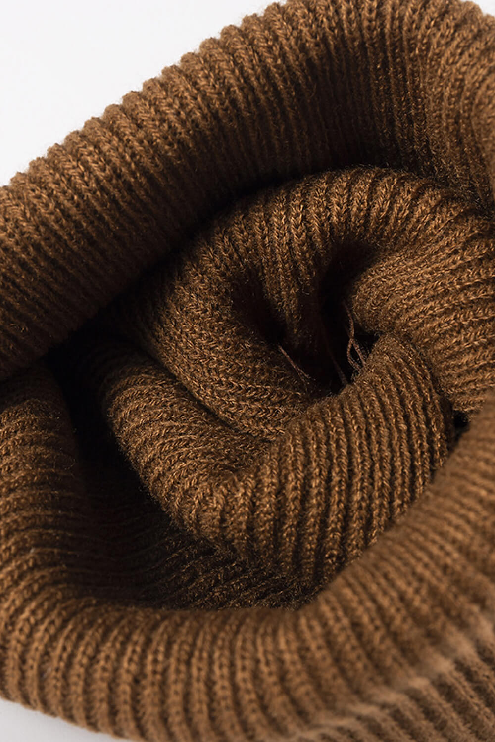 Brown ribbed knit acrylic beanie showing texture detail