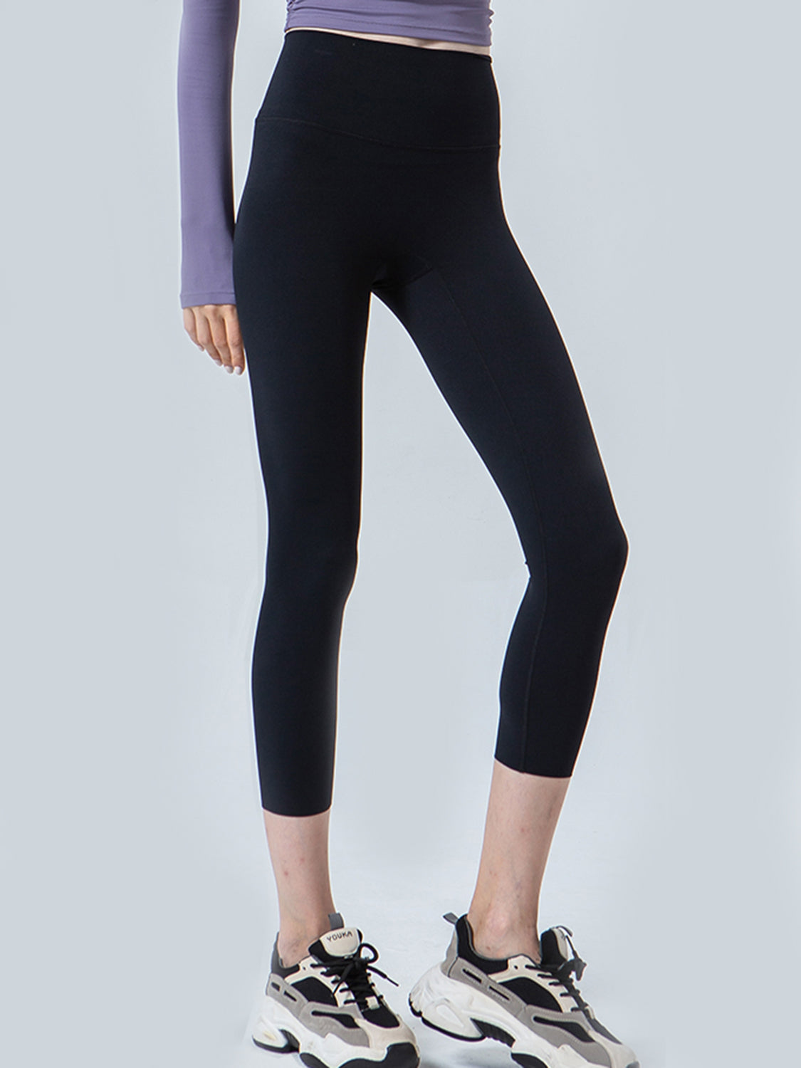 Black cropped leggings with a high waistband and subtle seam details.