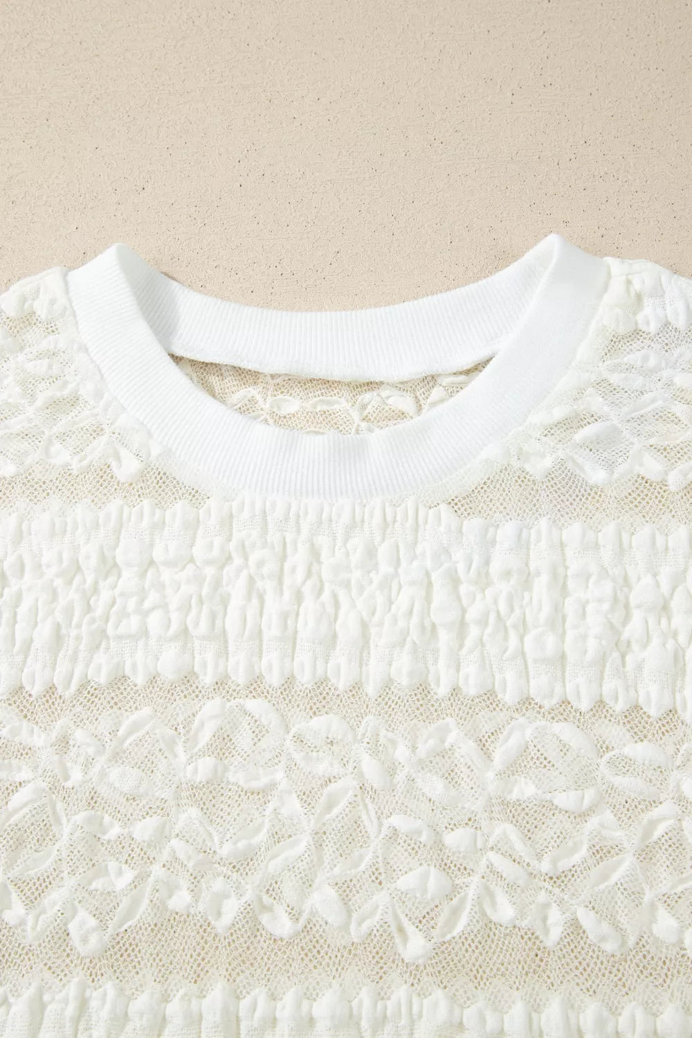 White lace patchwork sheer t-shirt with smocked detail and crew neck.