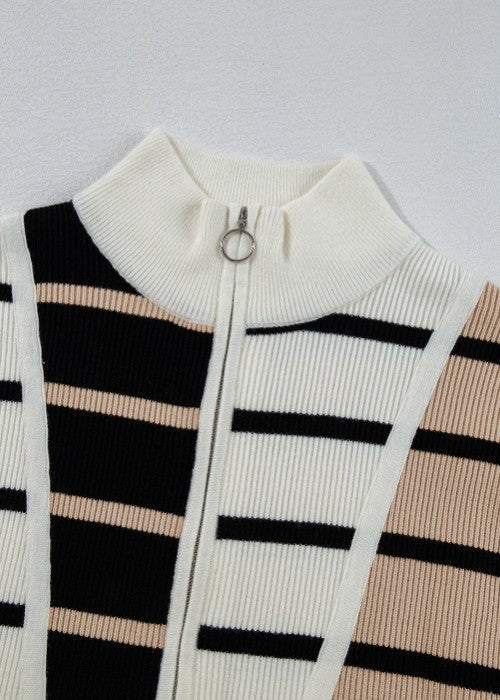 Colorblock ribbed zip polo with black, white, and beige stripes and a silver zipper detail.