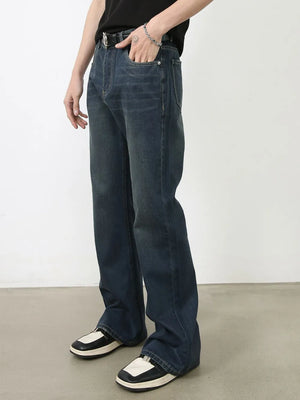 Dark wash denim flared trousers with subtle fading and bootcut leg.