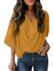 Yellow flowy half sleeve blouse with V-neck and draped front detail.