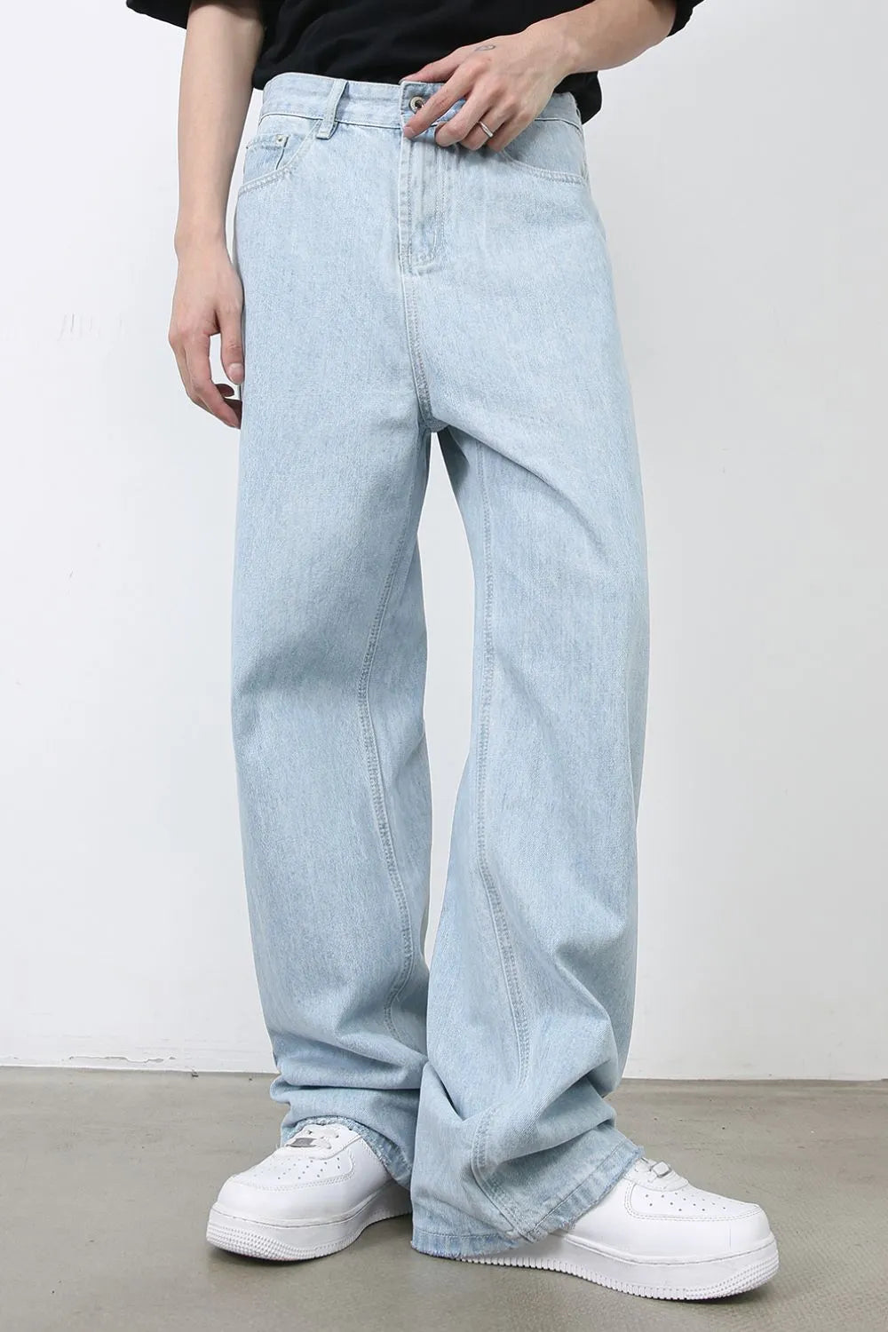 Baggy light blue denim palazzo jeans with button fly and wide leg.