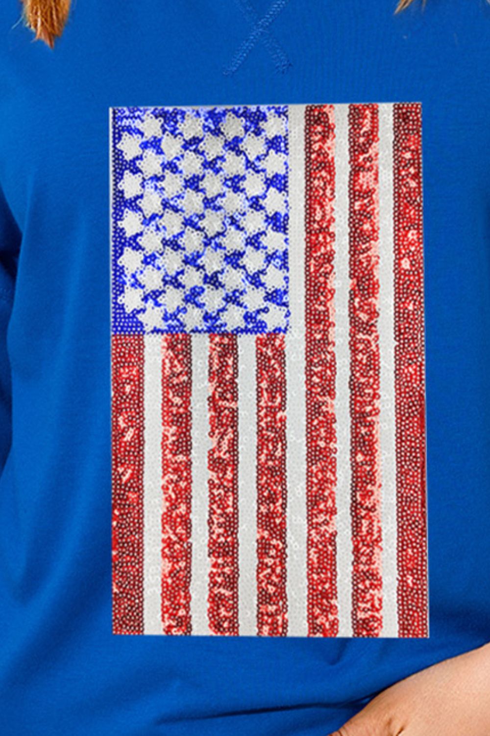 Royal blue boxy tee with embellished American flag sequin detail.