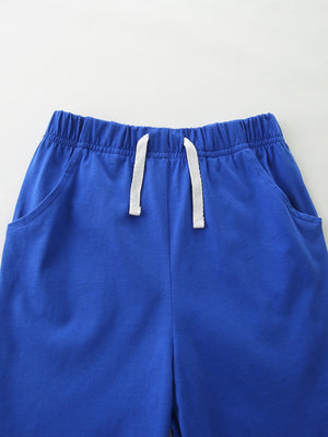 Blue cotton toddler shorts with elastic waistband and white drawstring.