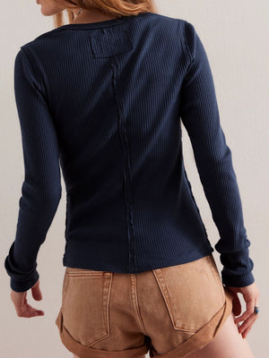 Dark Navy ribbed button-up second-skin top with raw seam detail and patch accent.