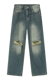 Distressed knee rip wide-leg jeans in medium wash cotton with a faded look.