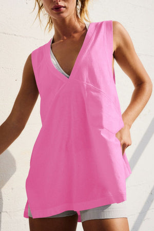 Oversized V-neck pocket tank top in Fuchsia Pink, featuring a relaxed fit and side slits.