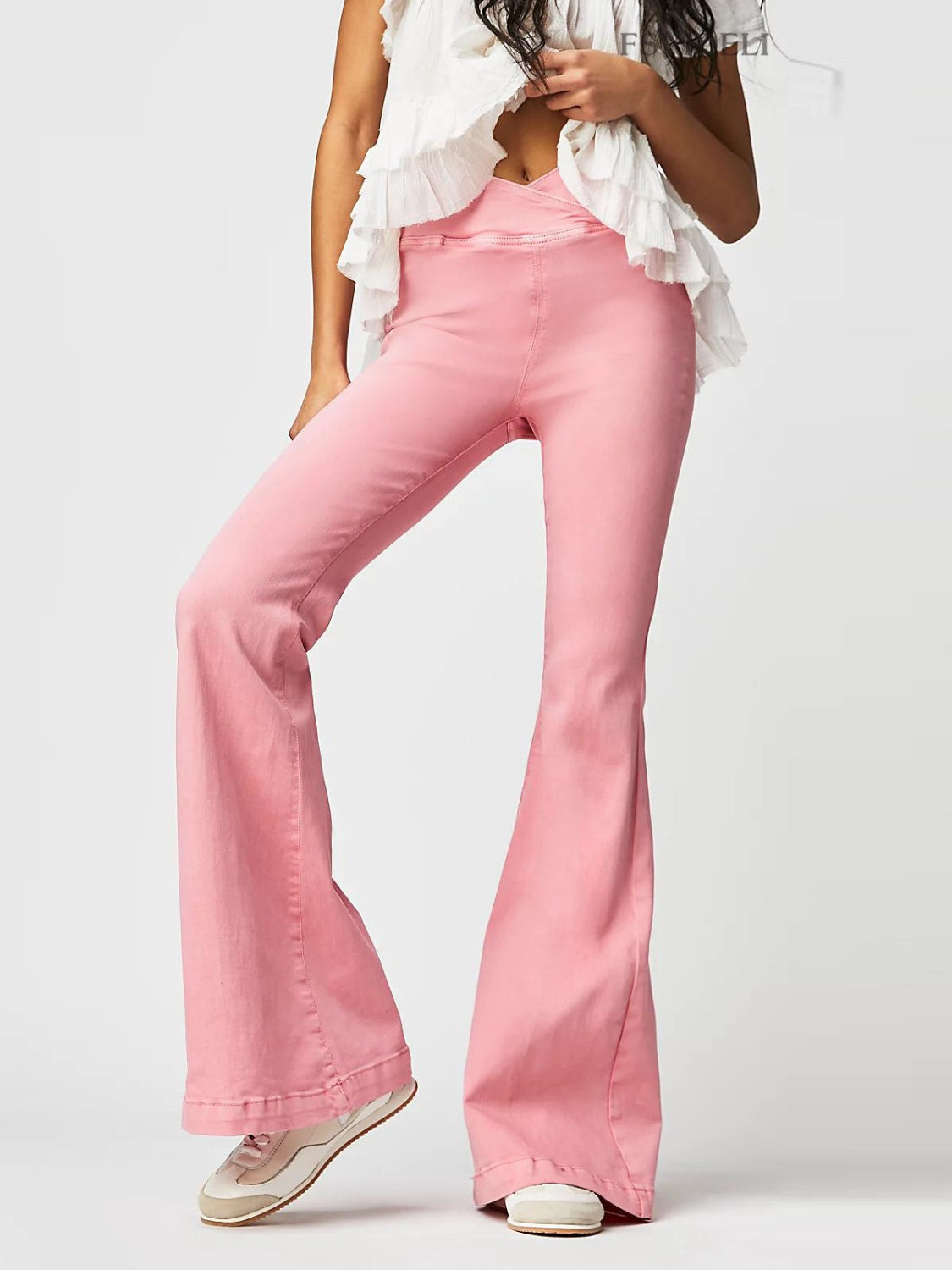 Watermelon pink denim flare jeans with a crisscross waistband detail.