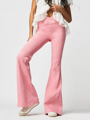 Watermelon pink denim flare jeans with a crisscross waistband detail.