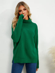 Green textured knit oversized turtleneck pullover sweater with ribbed details.