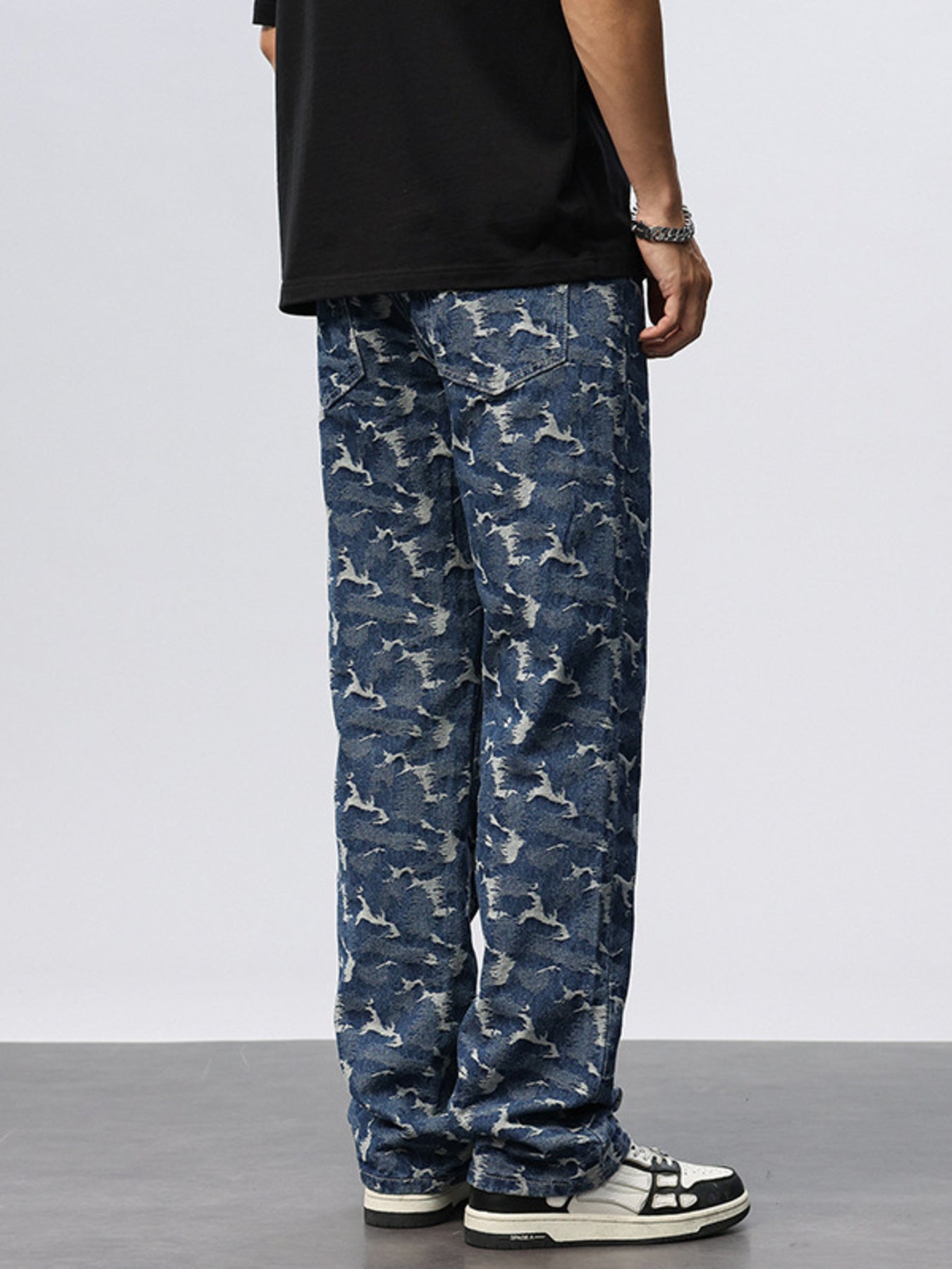 Relaxed fit blue cotton jeans with abstract camouflage pattern