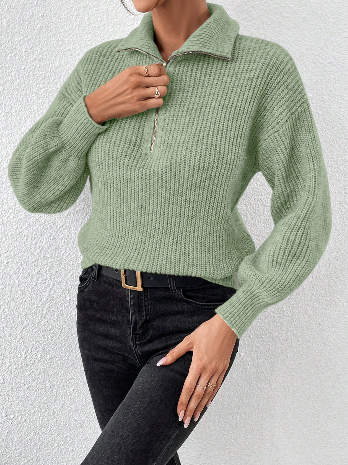 Matcha green ribbed zip-up sweater with a pointed collar and balloon sleeves.